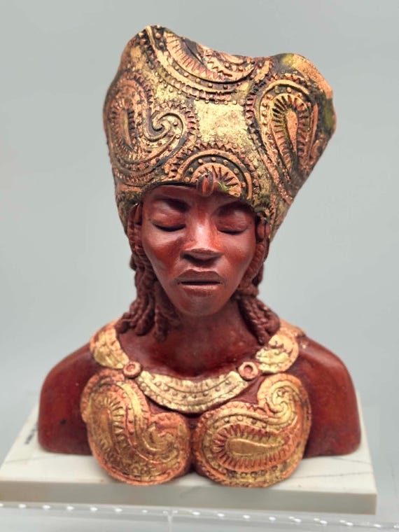 A handmade ceramic bust drawing on African heritage aesthetics — sculptural, gallery-worthy, and the kind of statement piece that anchors a room.
