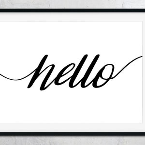 May include: A framed art print displaying the word "hello" in stylish, black cursive lettering on a white backdrop. The artwork is encased in a black frame, offering a minimalist and contemporary look. Ideal for home decoration.