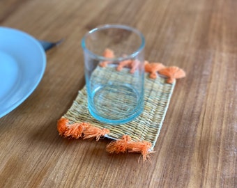 Moroccan glass bottoms with pom-poms and wicker for cooking and table decoration