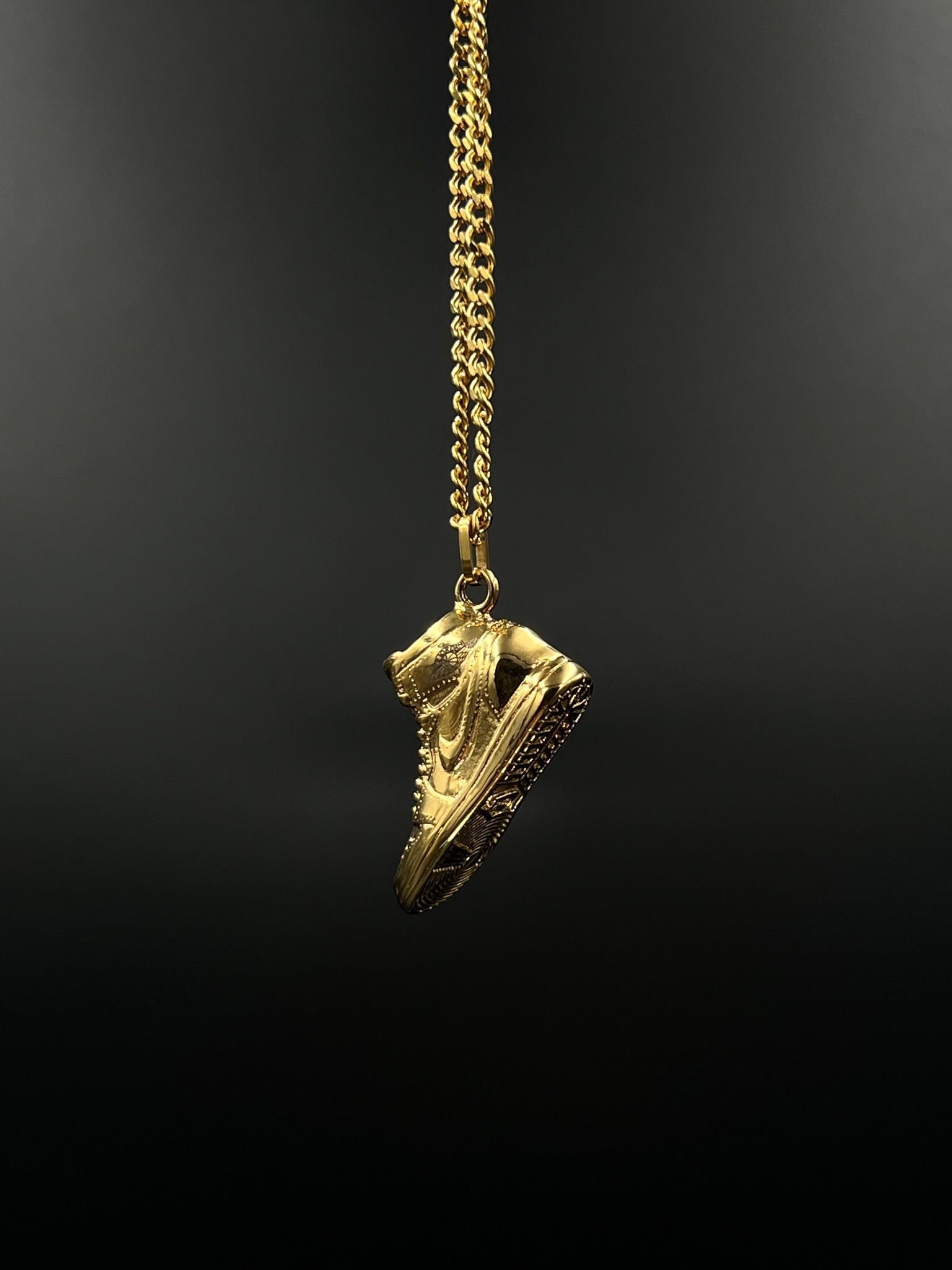 Gold nike swoosh necklace best sale
