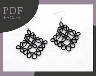 May include: A pair of black, openwork earrings with a floral design. The earrings are diamond-shaped and hang from silver-colored hooks. The words "PDF Pattern" are in the upper left corner.