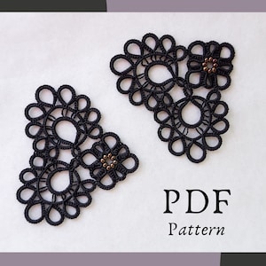 May include: Two black crocheted lace motifs with brown bead accents. The motifs are in the shape of flowers and are arranged in a triangular pattern. The text "PDF Pattern" is printed below the motifs.