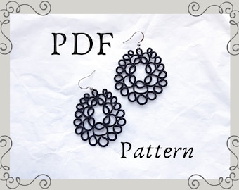 May include: PDF pattern for a pair of black crocheted earrings. The earrings are circular and feature a delicate, intricate design.