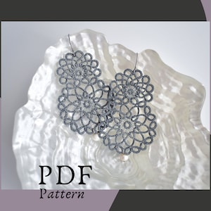 May include: A pair of gray crocheted earrings with a pearl accent. The earrings are displayed on a white background with the text "PDF Pattern".