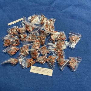 May include: A collection of small clear plastic bags containing orange ceramic disc capacitors. A white label reads Ceramic Disc Capacitor and another label states 30 values - 50 pieces per value. All Ceramics are rated for 50Volts Starting at 1pF NPO ending at 1uF X7R.