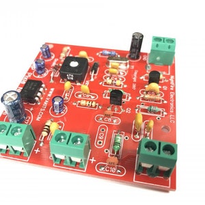 May include: A red circuit board with green terminal blocks, a black button, and various electronic components. The board has the text "NightFire Electronics LLC" and "www.VAKITS.COM" printed on it.