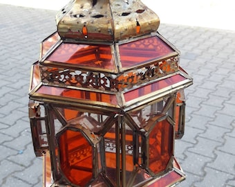 Oriental brass lantern with clear and red glass