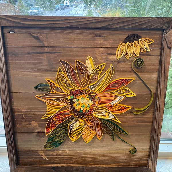 Sunflower art! Quilled sunflower on wood frame board. 13.75x13.75x1.5.  Enjoy sunflowers even in the rain!