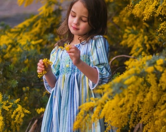 Tasteful long sleeves yellow and blue striped smocked dress