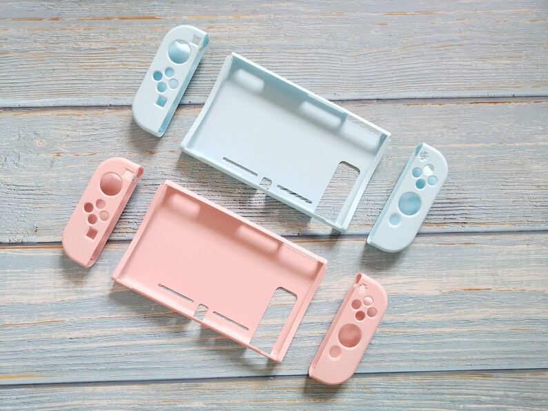 May include: Two sets of Nintendo Switch console shell replacements. One set is light blue and the other is pink. Each set includes a console back, two joy-con controllers, and a screen cover.