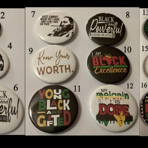 May include: A set of 16 round buttons with various designs celebrating Black History Month. The buttons feature phrases like "Black and Magic", "I Am Black History Strong", "Know Your Worth", "Black Powerful", "Young Black and Gifted", and "Make Every Month Black History Month".