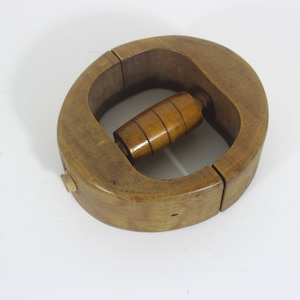 Vintage or antique wood hat stretcher mold millinery display store, wall art