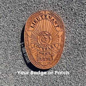 May include: A wooden police badge with the text "LIEUTENANT" at the top and "LOCKHART POLICE" in the center. The badge features the Texas state seal and the number "8806". The text "Your Badge or Patch" is at the bottom.
