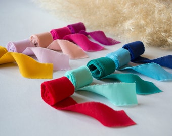 Hand-torn stretch crepe ribbon for wedding invitations, favors and decorations.