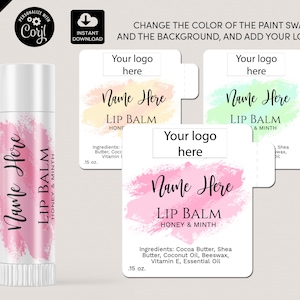 Puede incluir: Un tubo de bálsamo labial rosa y blanco con un diseño de estilo acuarela y el texto "Name Here Lip Balm Honey & Minth .15 oz." La imagen también incluye tres etiquetas imprimibles con el mismo diseño en diferentes colores: amarillo, verde y rosa. Cada etiqueta tiene el texto "Your logo here" y "Name Here Lip Balm" con el sabor que se indica debajo.