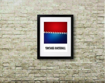 May include: Framed art print with a red and blue abstract design, white baseball stitch detail, and the text "CHICAGO BASEBALL". The artwork is displayed on a brick wall. The print is in a black frame.