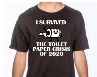 May include: Dark grey t-shirt with the text "I SURVIVED THE TOILET PAPER CRISIS OF 2020" and a cartoon toilet paper roll character. The shirt is worn by a person in blue jeans.