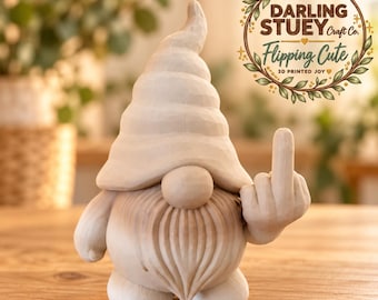May include: A light-coloured gnome figurine with a tall, spiralled hat and a long beard, gesturing with a middle finger. The text DARLING STUEY Craft Co. Flipping Cute 3D PRINTED JOY is visible in a circular wreath design in the upper right corner.