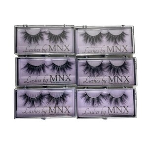 May include: Six clear plastic boxes containing individual pairs of false eyelashes. Each box has a purple background with the text "Lashes by MNX" printed on it.