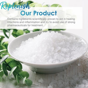 May include: A blue bag of natural paw healing solution for dogs. The bag has a white label with the text "Replenish Natural Paw Healing Solution" and a picture of a French Bulldog. The bag is sitting on a white surface with white salt crystals.