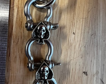 Handmade Metal Glove Clip: Skull & Spade Design
