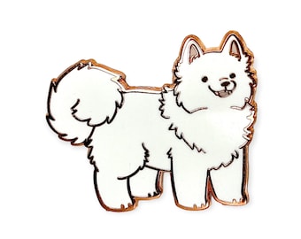 May include: A white, fluffy dog enamel pin with a rose gold outline. The pin features a smiling dog with a fluffy tail and ears. The dog is standing, facing to the right, and has a black nose and eyes.