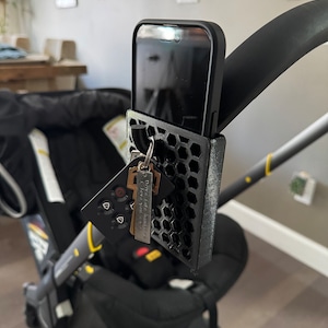 Suporte para telefone e gancho para chaves