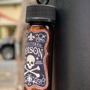 Vintage skull and crossbones necklace with miniature jar that opens