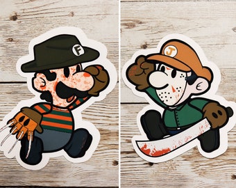May include: Two cartoon stickers of Mario characters dressed as horror movie villains. The first sticker is of Mario dressed as Freddy Krueger, wearing a striped sweater, a brown glove with blades, and a brown fedora with the letter "F" on it. The second sticker is of Luigi dressed as Jason Voorhees, wearing a green and brown jumpsuit, a hockey mask with blood splatters, and a brown glove holding a machete.