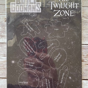 May include: A black and white sticker sheet with cut-out shapes of characters and logos from the Twilight Zone television series. The sheet includes the show's logo, the intro doll, Rod Sterling, and the titles of episodes like "The Invaders" and "Will the Real Martian Please Stand Up?"