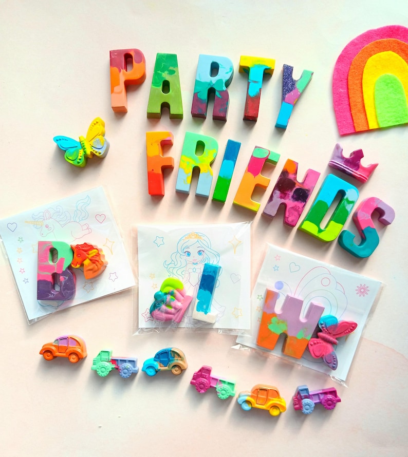 May include: A set of colorful crayon letters spelling "PARTY FRIENDS" with a rainbow felt cutout, a butterfly, and small cars. The letters are packaged in clear bags with coloring pages.
