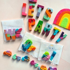 Colorful handmade crayons in shapes of letters,cars, butterflies, and more with fun coloring kits. Perfect for kids' party favors, themed birthdays, creative play, school events, and educational gifts. Includes vibrant designs and non-toxic materials