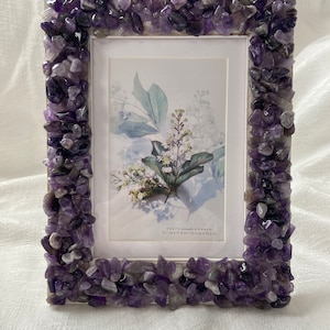 Crystal stone picture frame. Comes in amethyst, or rose quartz.