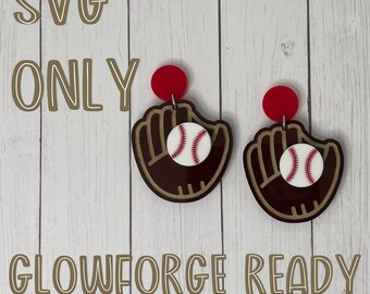 May include: SVG Only - Glowforge Ready - A pair of earrings featuring a brown baseball glove with a white baseball inside. The earrings are made of acrylic and have red tops.