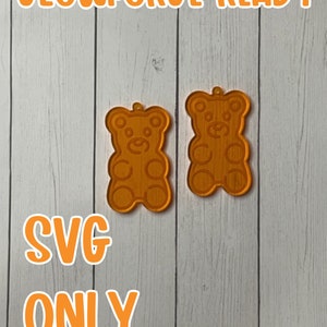 May include: Two orange gummy bear shaped SVG files, ready to be used with a Glowforge.