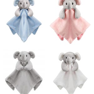 May include: Four plush elephant baby security blankets. The blankets are in blue, pink, gray, and white. Each blanket has a gray elephant attached to it.