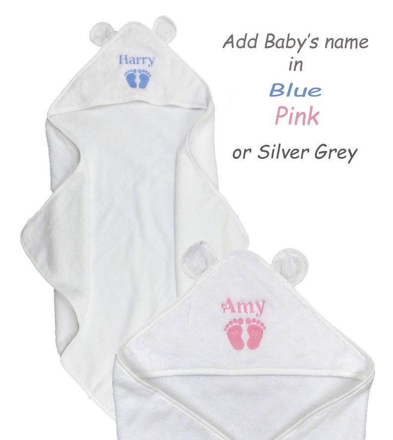 May include: White hooded baby towel with bear ears. The towel features embroidered baby footprints and a name in blue or pink. Text on the image reads: Add Baby's name in Blue, Pink, or Silver Grey.