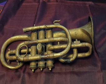 Antique brass bugle style trumpet