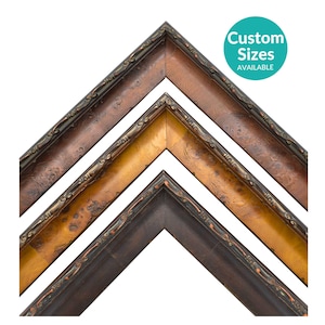 May include: Three nested V-shaped picture frame corner samples with ornate edges. The top frame is dark brown, the middle is a mottled golden-yellow, and the bottom is a solid dark charcoal. A teal circle contains the text Custom Sizes AVAILABLE.