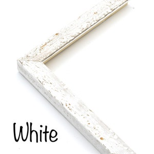 May include: White painted wooden picture frame with a distressed finish. The frame is shown in a corner view.