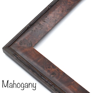 May include: A close-up of a mahogany picture frame with a dark brown finish. The frame has a simple, classic design with a slightly raised edge.