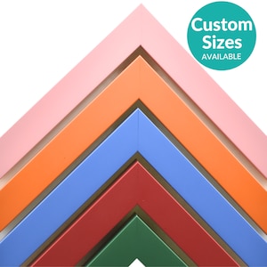 Colorful modern picture frames in pink, orange, blue, red, and green. Sleek contemporary design for artwork, posters, or photos. Custom sizes available. Perfect for vibrant home, office, or gallery wall decor.