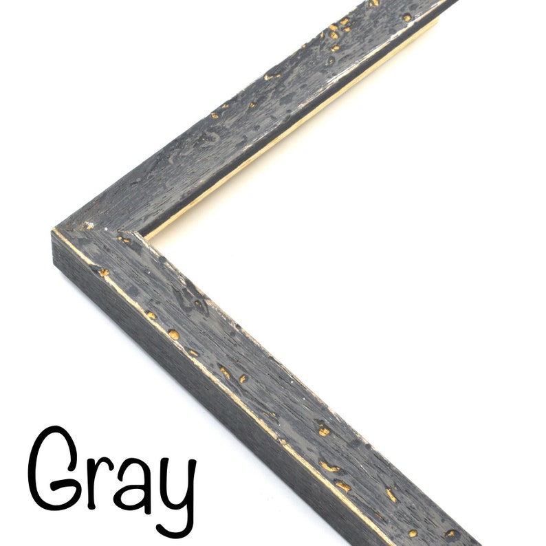 May include: Close-up of a gray picture frame with a distressed wood finish and a gold-colored inner edge. The frame is angled to show the corner.