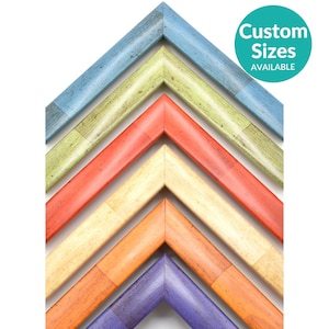 May include: A set of six colorful wooden picture frames, each with a different color and a distressed finish. The frames are arranged in a pyramid shape, with the largest frame at the top and the smallest frame at the bottom. The frames are all made of wood and have a smooth finish. The colors of the frames are blue, green, red, yellow, orange, and purple. The frames are all in the same style, with a simple, rectangular shape. The frames are all in focus and the colors are vibrant. Custom sizes are available.