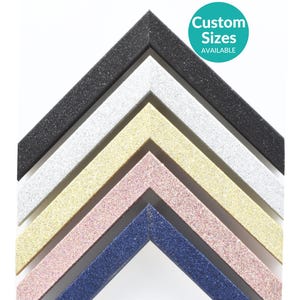 May include: Five different colours of glitter picture frames, including black, white, gold, pink, and blue. Custom sizes available.