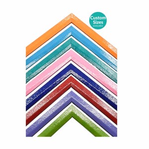 May include: A collection of nested V-shaped picture frame corner samples in orange, light blue, teal, pink, dark blue, red, purple, and green. Each frame features a textured, glossy finish and a circular teal badge stating Custom Sizes AVAILABLE.