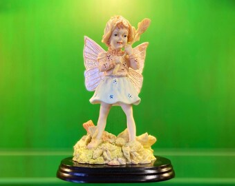 Vintage Fairy Holding Flower Figurine, Hand Sculptured Cold Cast Fairy Holding Flower Figurine, Hand Painted Fairy Statue, Fairy Sculpture.