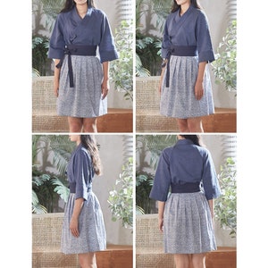 May include: A four-panel image of a blue wrap top with three-quarter sleeves and a matching belt, paired with a patterned skirt. The skirt is a light gray with a small white pattern. The outfit is a modern take on traditional Asian attire.