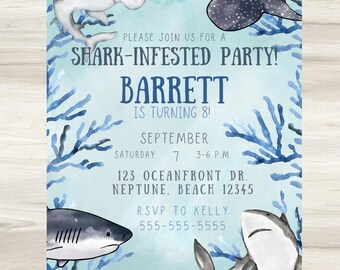 May include: A light blue party invitation with illustrations of sharks and blue coral. The invitation reads "SHARK-INFESTED PARTY!" and includes the name "BARRETT" and party details.