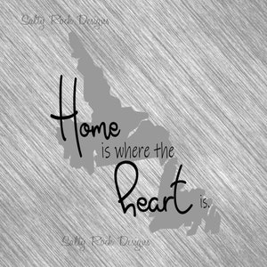 May include: A grayscale graphic with the text "Home is where the heart is." The words are in a handwritten style, with a gray outline of a landmass behind the text. The background has a brushed metal texture.